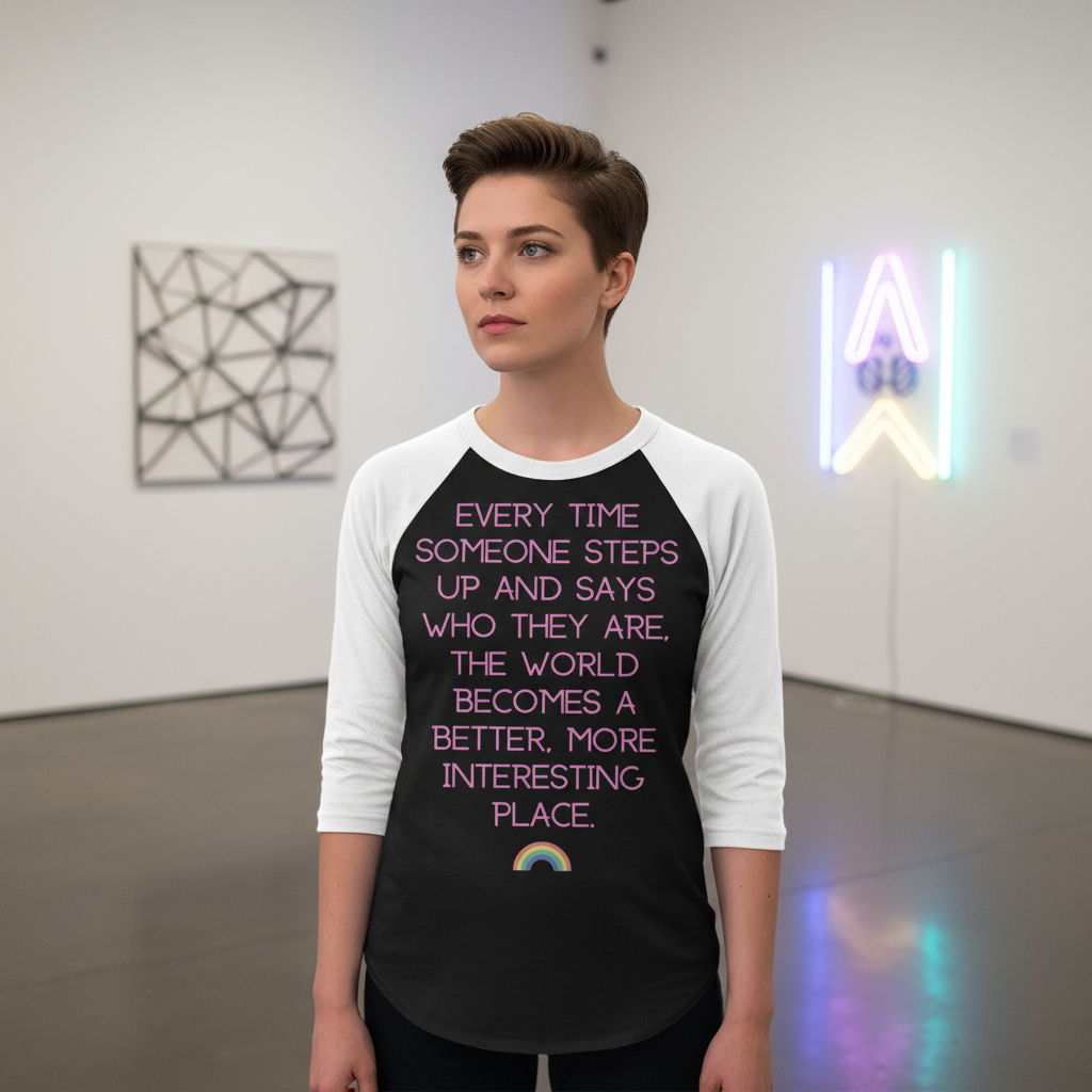 Model wearing a black-and-white raglan shirt with pink quote lettering and a small rainbow
