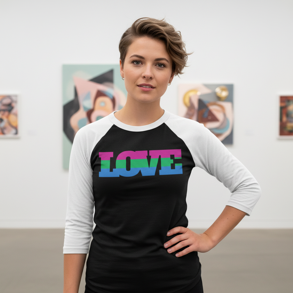Polysexual "LOVE" 3/4 sleeve raglan tee with bold, colorful text; short-haired person beams in front of abstract art.