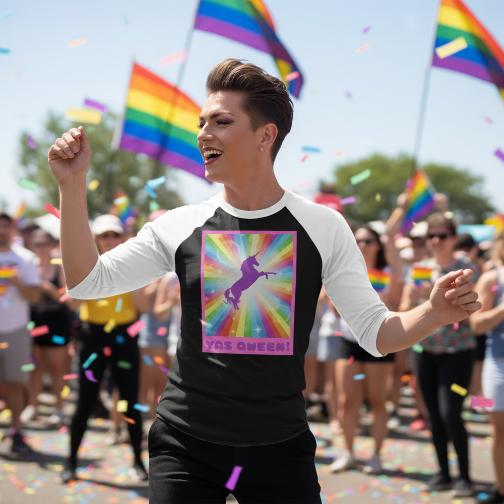 Person wearing a black-and-white raglan shirt with a rainbow unicorn graphic and “YAS QUEEN!” text at Pride