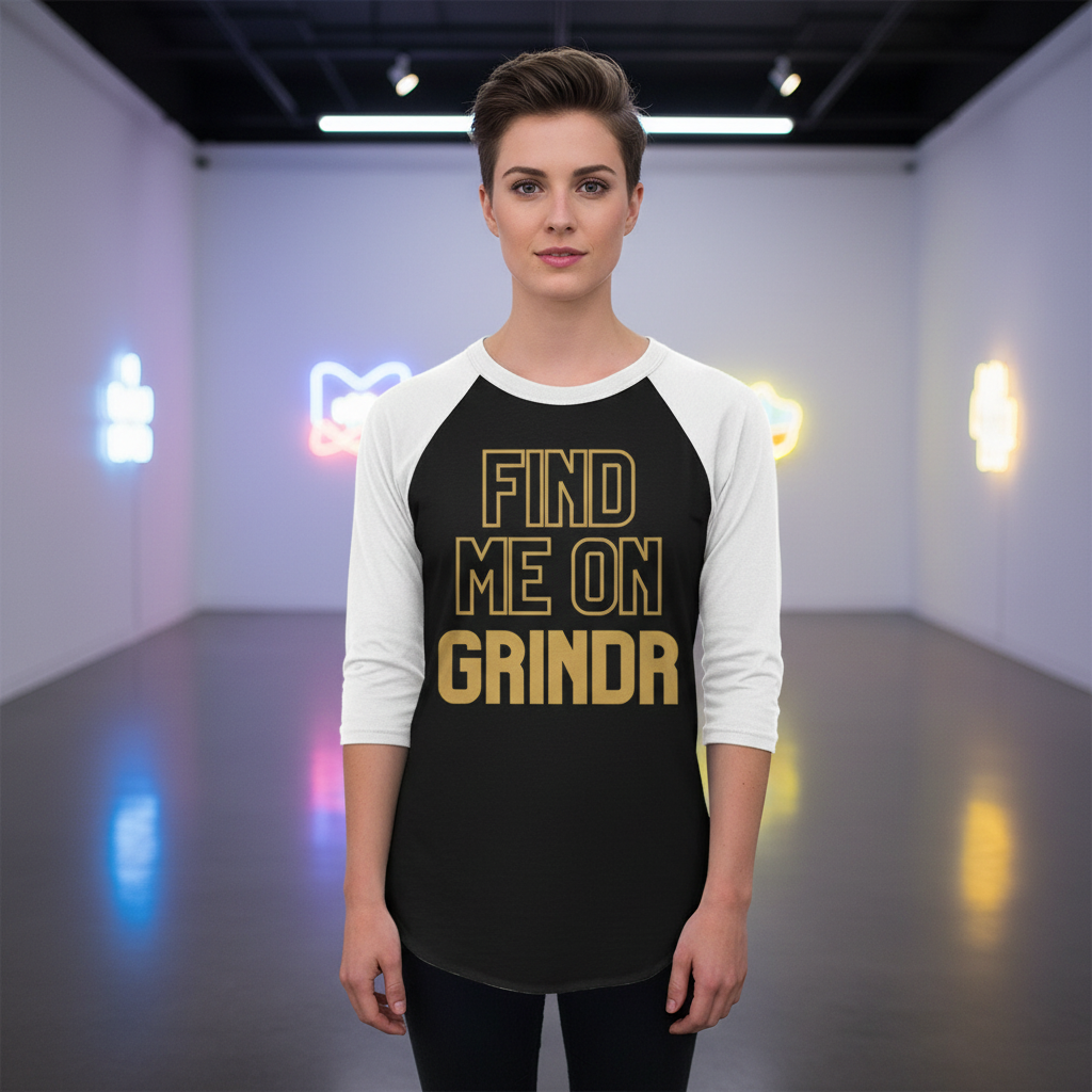Front-facing model wearing a black-and-white raglan shirt reading “FIND ME ON GRINDR” in gold