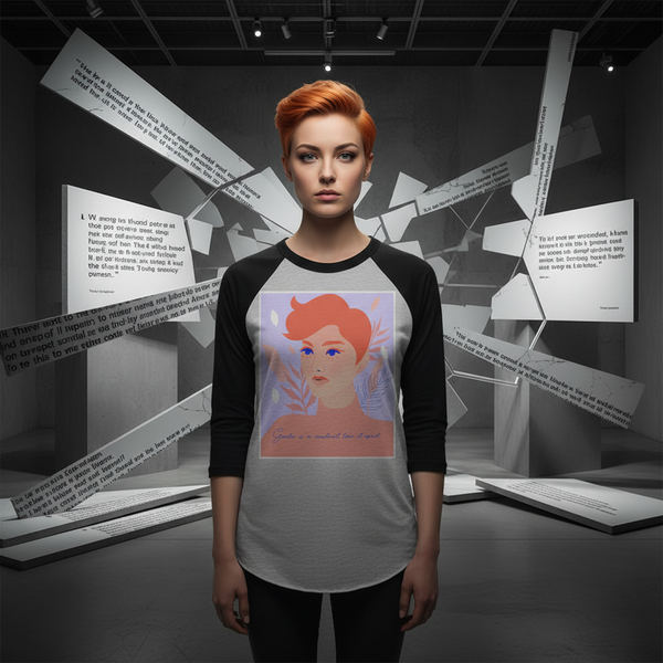 3/4 sleeve raglan shirt with “Gender Is A Construct Tear It Apart” slogan, worn by orange-haired woman in moody gallery.