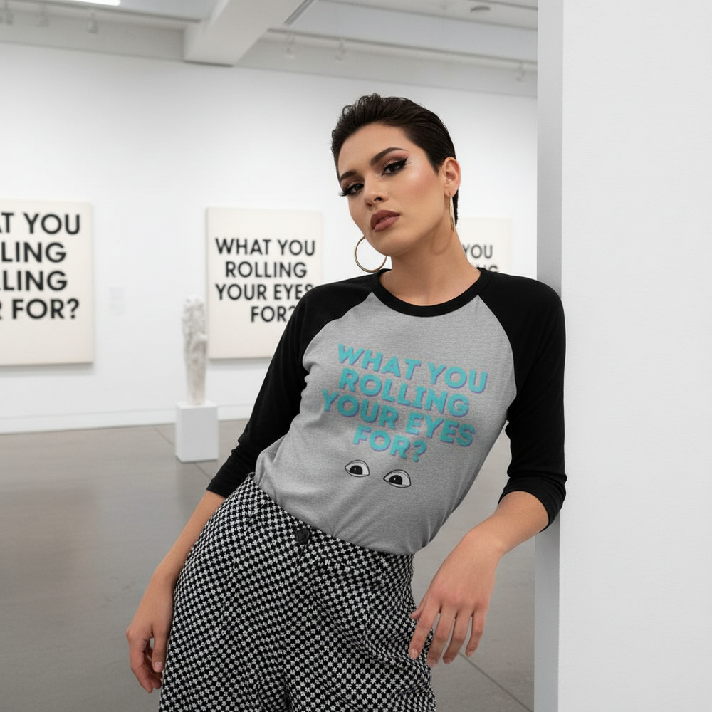 Model wearing a gray-and-black raglan shirt reading “WHAT YOU ROLLING YOUR EYES FOR?”