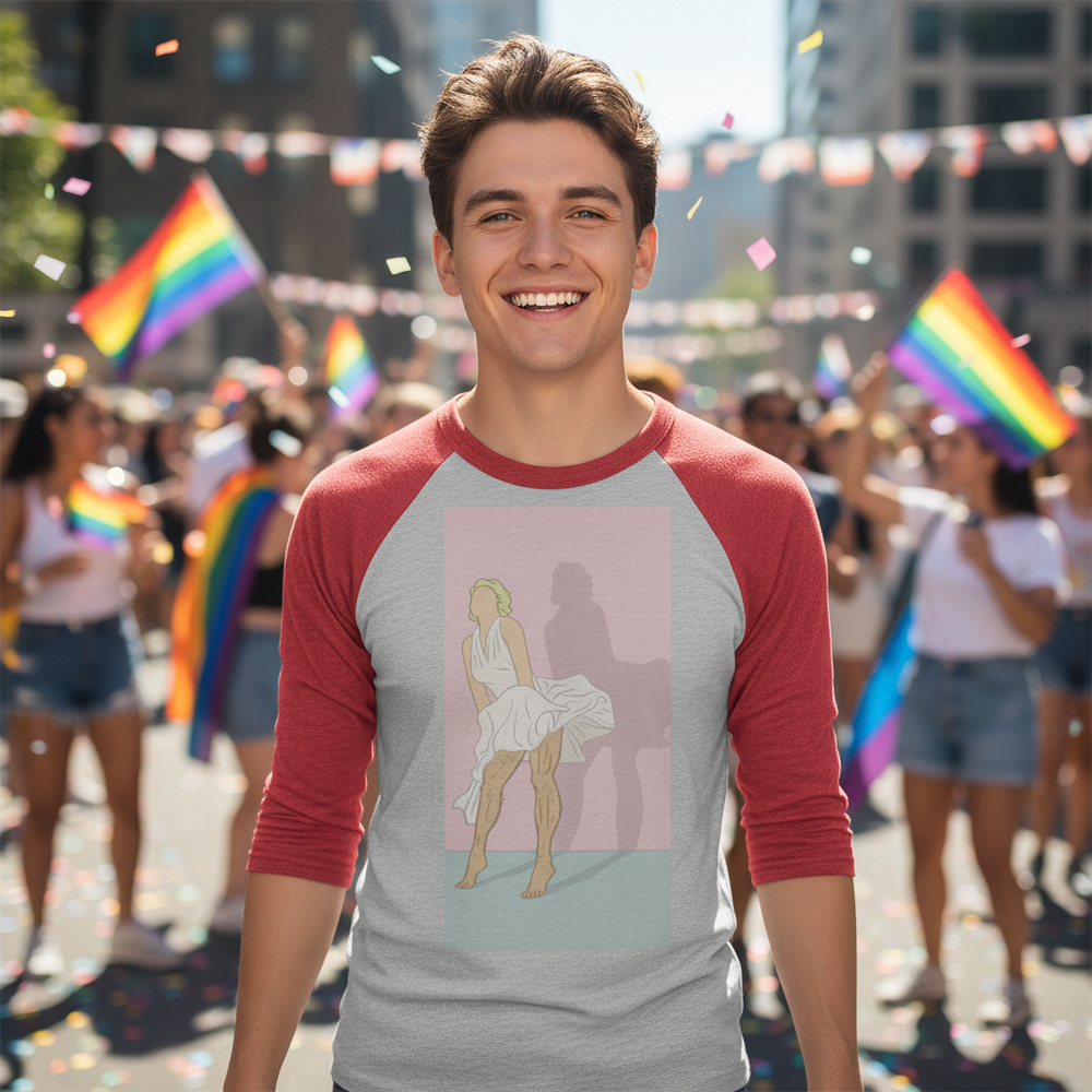 Daddy Monroe 3/4 sleeve raglan shirt on a smiling young man at Pride, rainbow flags flying and confetti falling in the city.