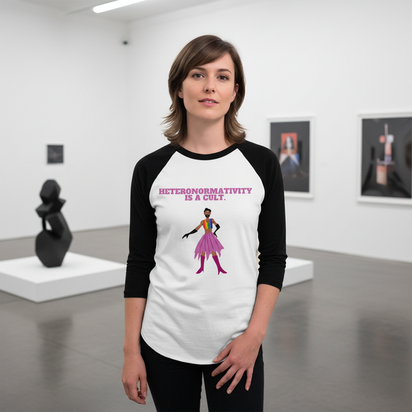 3/4 sleeve raglan tee with “Heteronormativity Is A Cult” in bold, queer graphic of person in pink skirt; art gallery setting.