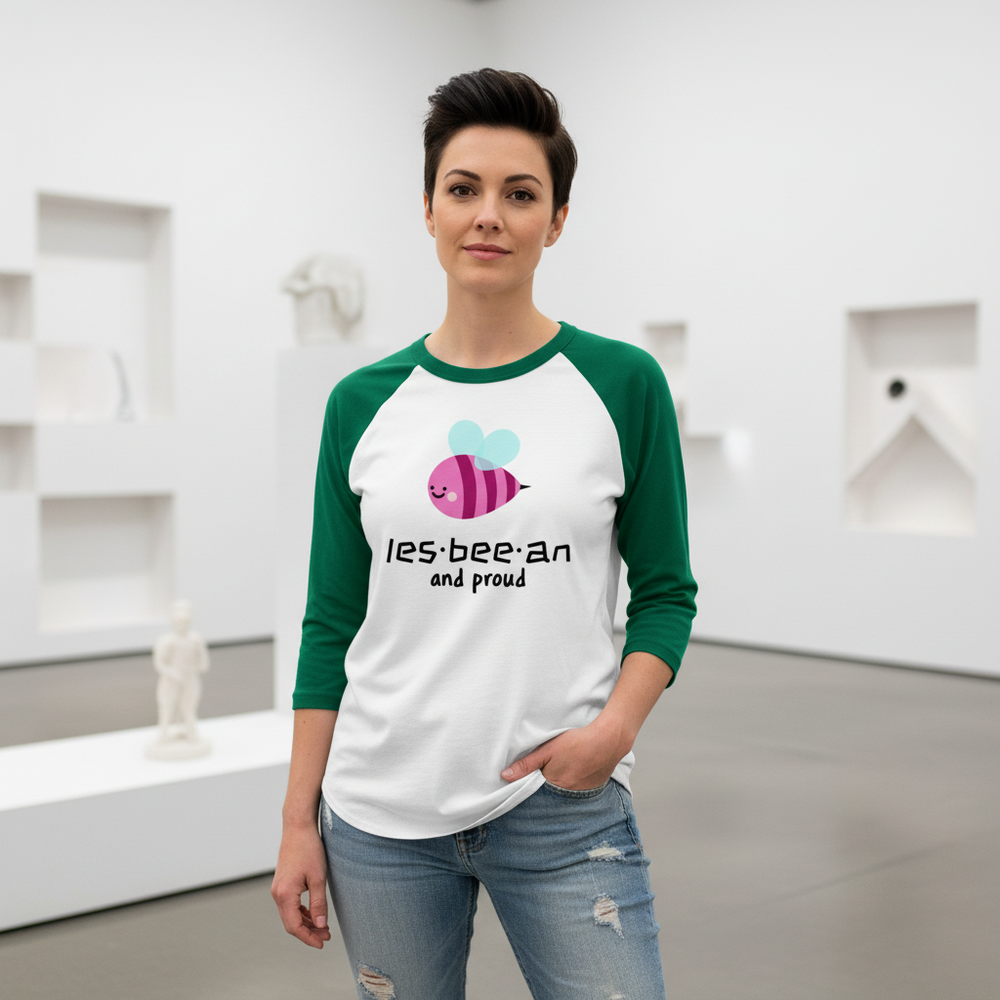 Les-Bee-An And Proud 3/4 sleeve raglan shirt with a cartoon bee and pride text, worn by a queer person in ripped jeans.