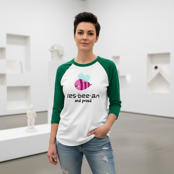 Les-Bee-An And Proud 3/4 sleeve raglan shirt with a cartoon bee and pride text, worn by a queer person in ripped jeans.