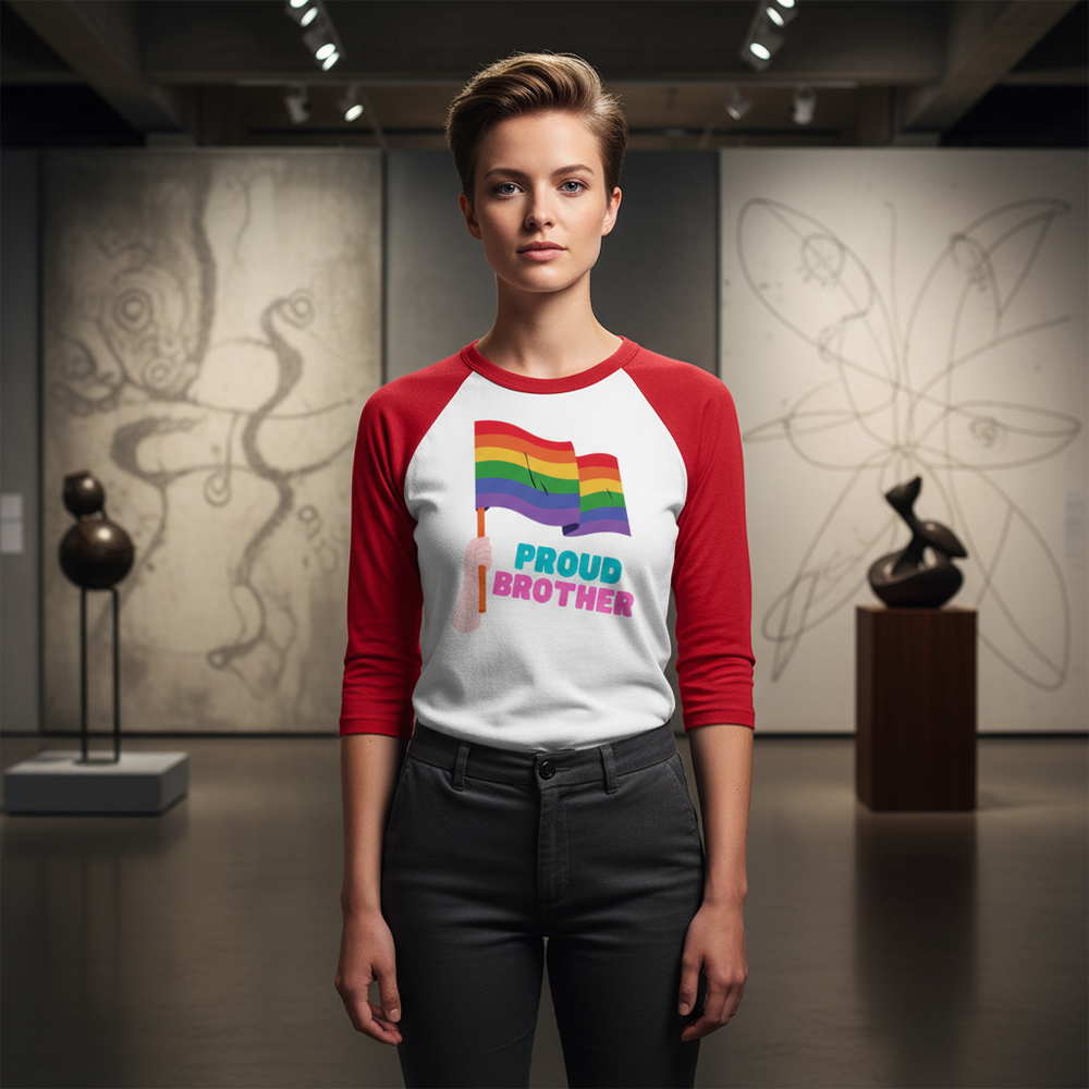 3/4 sleeve raglan shirt in red and white, “Proud Brother” text, rainbow flag accent; queer person stands in art gallery.