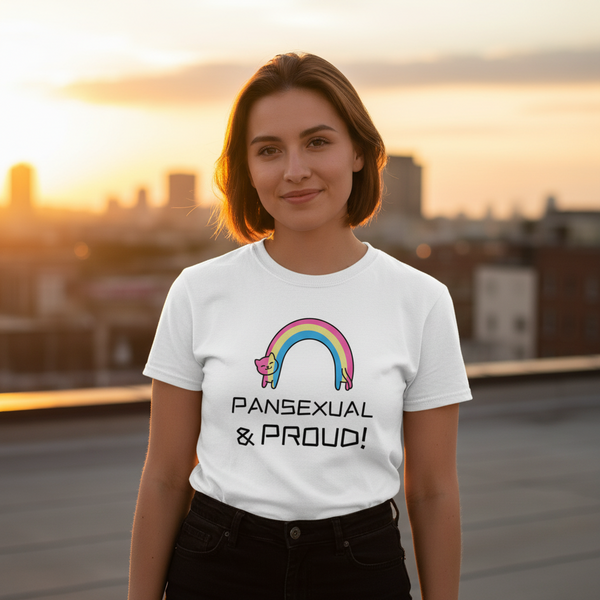 Pansexual & Proud T-Shirt with a rainbow and cat graphic, bold “Pansexual & Proud!” text, worn on a sunset city rooftop.