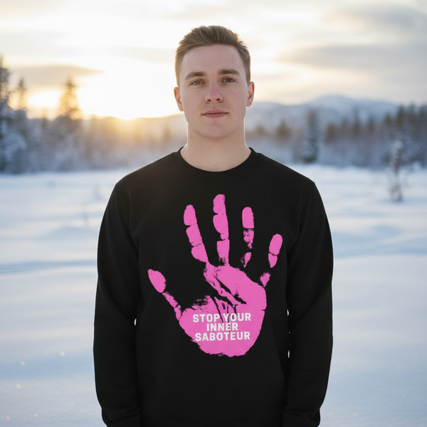 Model wearing a black sweatshirt with a pink hand graphic and “STOP YOUR INNER SABOTEUR” text