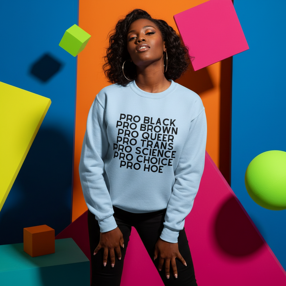 Light blue sweatshirt reading “PRO BLACK PRO BROWN PRO QUEER PRO TRANS PRO SCIENCE PRO CHOICE PRO HOE”