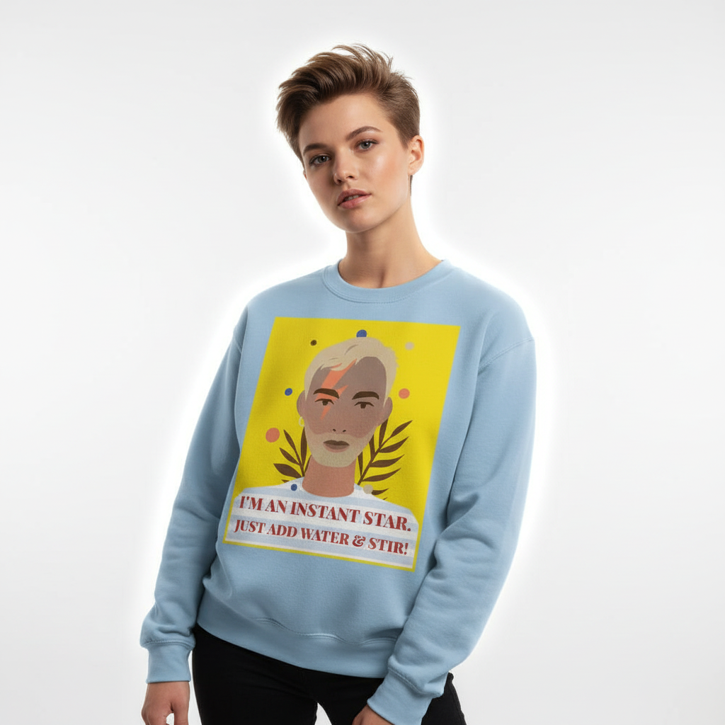 Model wearing a light blue sweatshirt with a pop-art portrait and “I'M AN INSTANT STAR” slogan