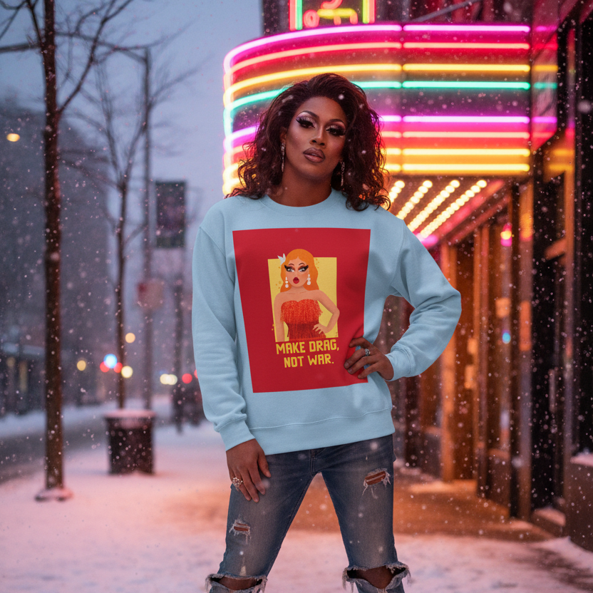Make Drag Not War Unisex Sweatshirt worn by a drag performer on a snowy, neon-lit sidewalk, featuring a pop-art drag queen illustration and slogan, celebrating LGBTQ pride with vibrant, inclusive energy.