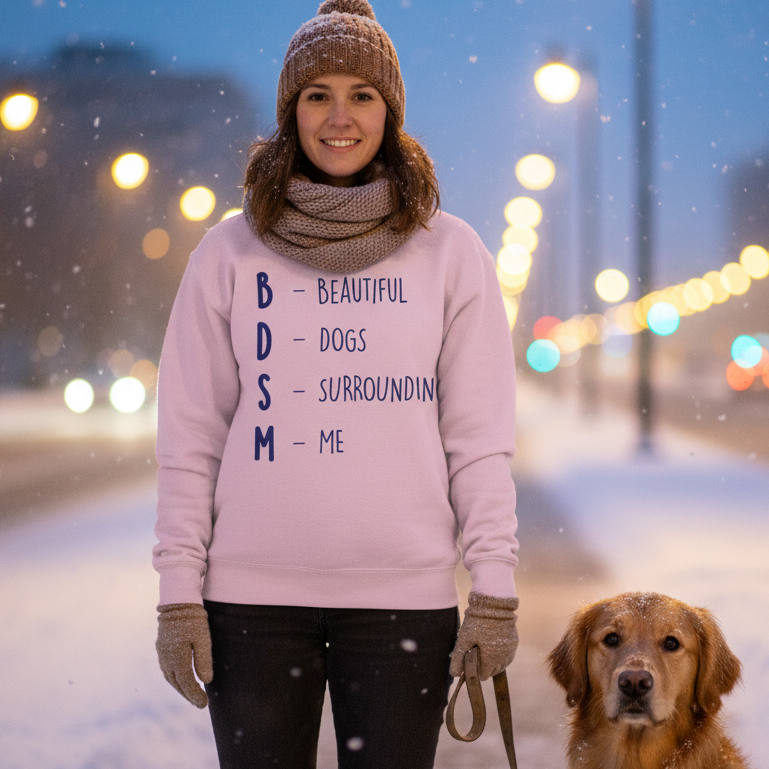 Pink sweatshirt reading “BDSM – Beautiful Dogs Surrounding Me,” modeled outdoors with a dog in snow