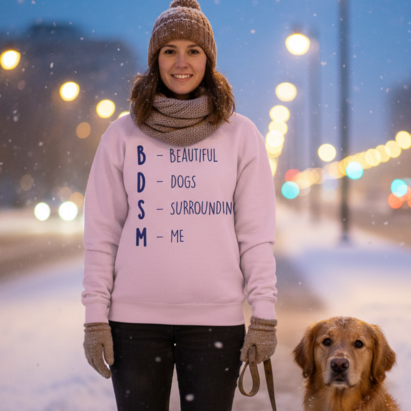 Pink sweatshirt reading “BDSM – Beautiful Dogs Surrounding Me,” modeled outdoors with a dog in snow