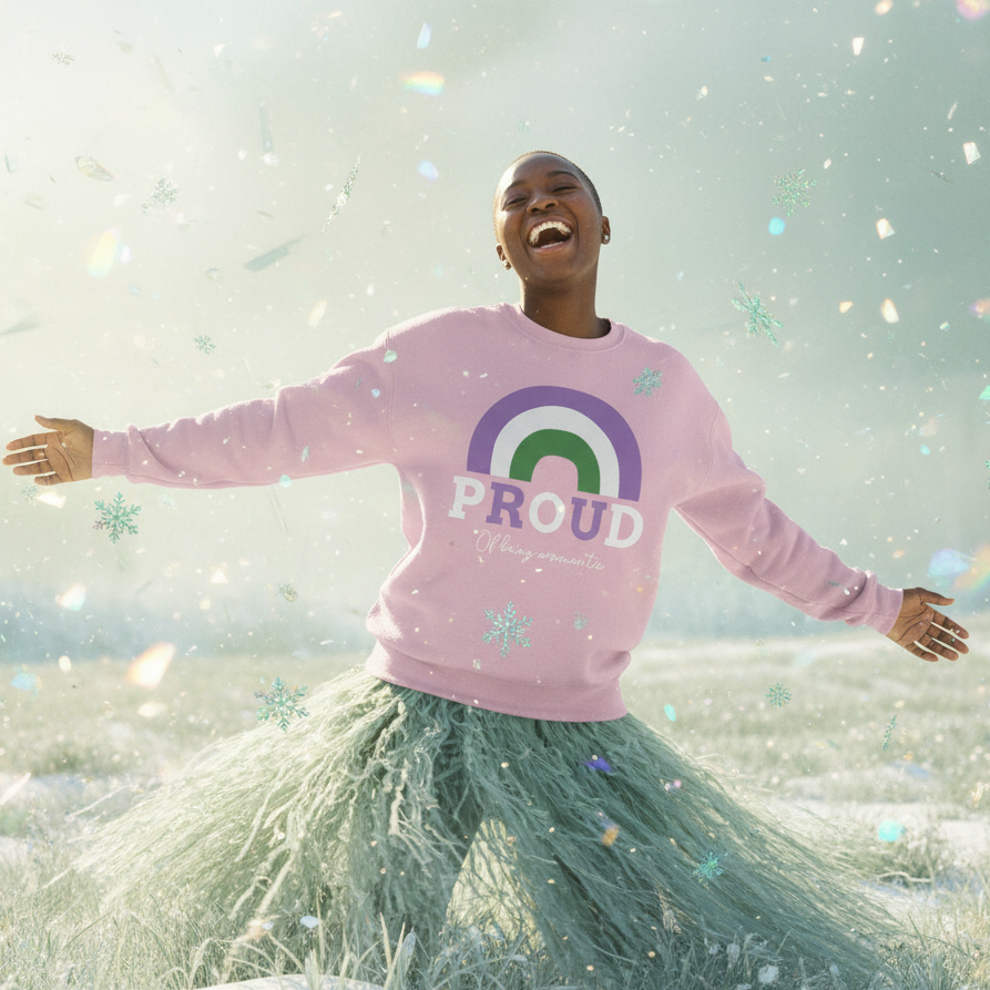 Person joyfully embracing the snowy outdoors, wearing the Proud Of Being Aromantic Unisex Sweatshirt, featuring a green-and-purple rainbow and PROUD text. Emphasizes queer pride and visibility with cozy, empowering style.