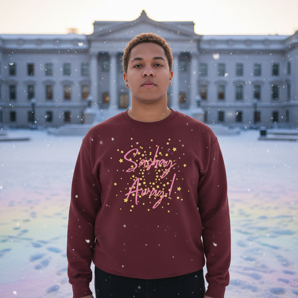 Model wearing a burgundy sweatshirt with pink “Sashay Away” lettering and gold stars in falling snow
