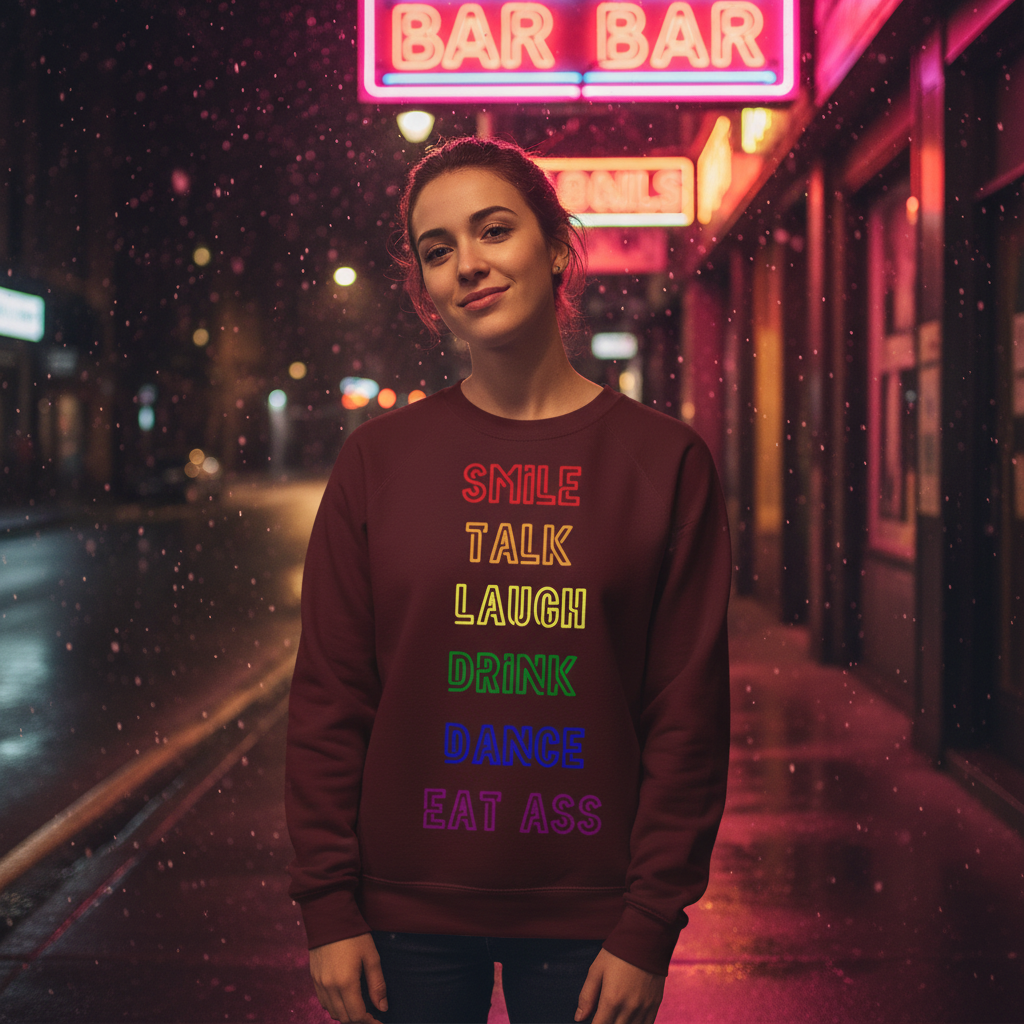 Young woman on neon-lit street wearing the Smile, Talk, Laugh, Drink, Dance, Eat Ass Unisex Sweatshirt. Celebrating LGBTQ pride, it's a cozy, empowering fashion choice for self-expression and visibility.
