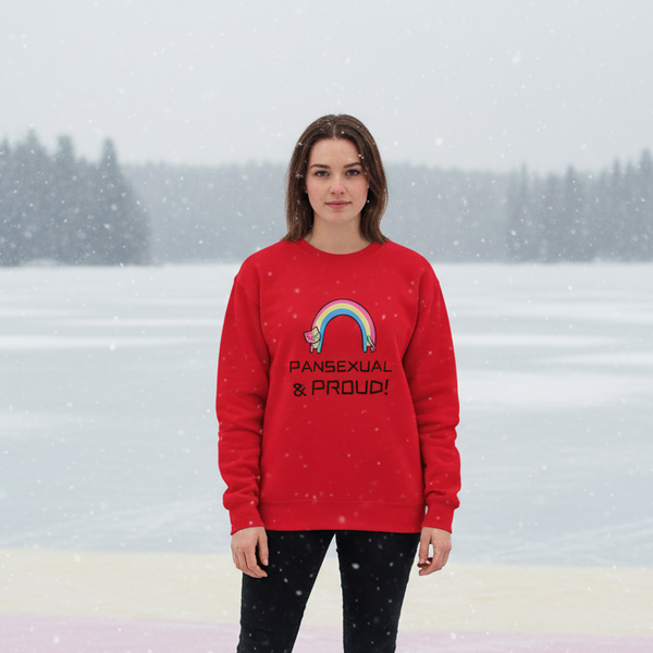 Person wearing a red sweatshirt with a rainbow and “PANSEXUAL & PROUD!” text in falling snow