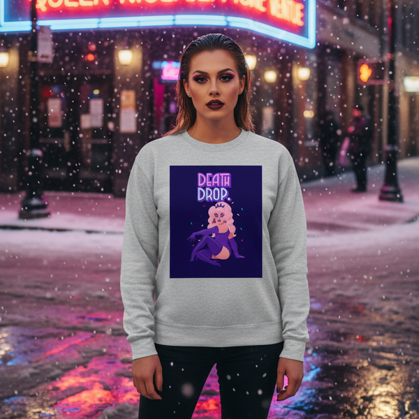 Model wearing a light-gray sweatshirt with a neon “DEATH DROP” drag-queen graphic in falling snow