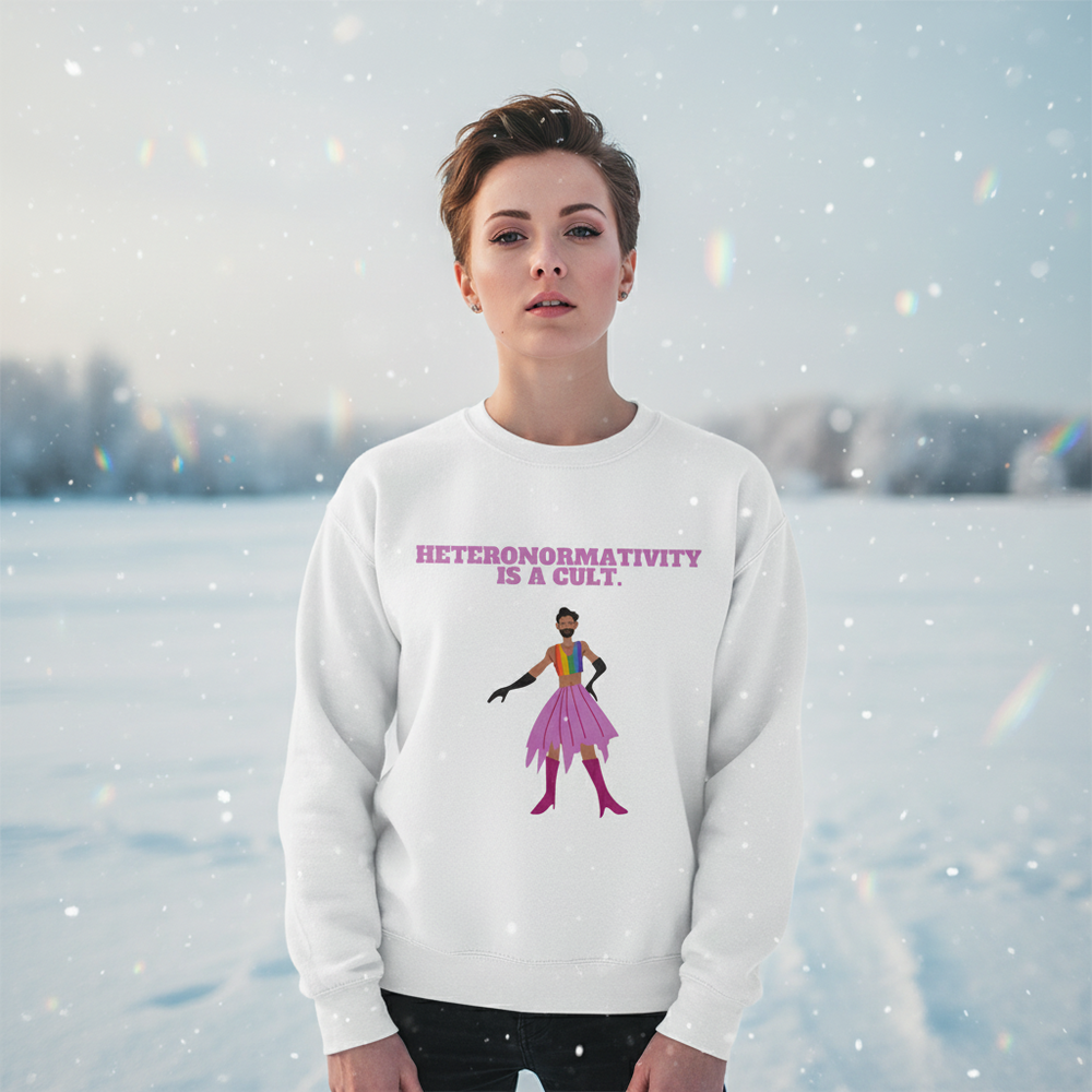 White sweatshirt reading “HETERONORMATIVITY IS A CULT.” with a colorful drag-inspired figure