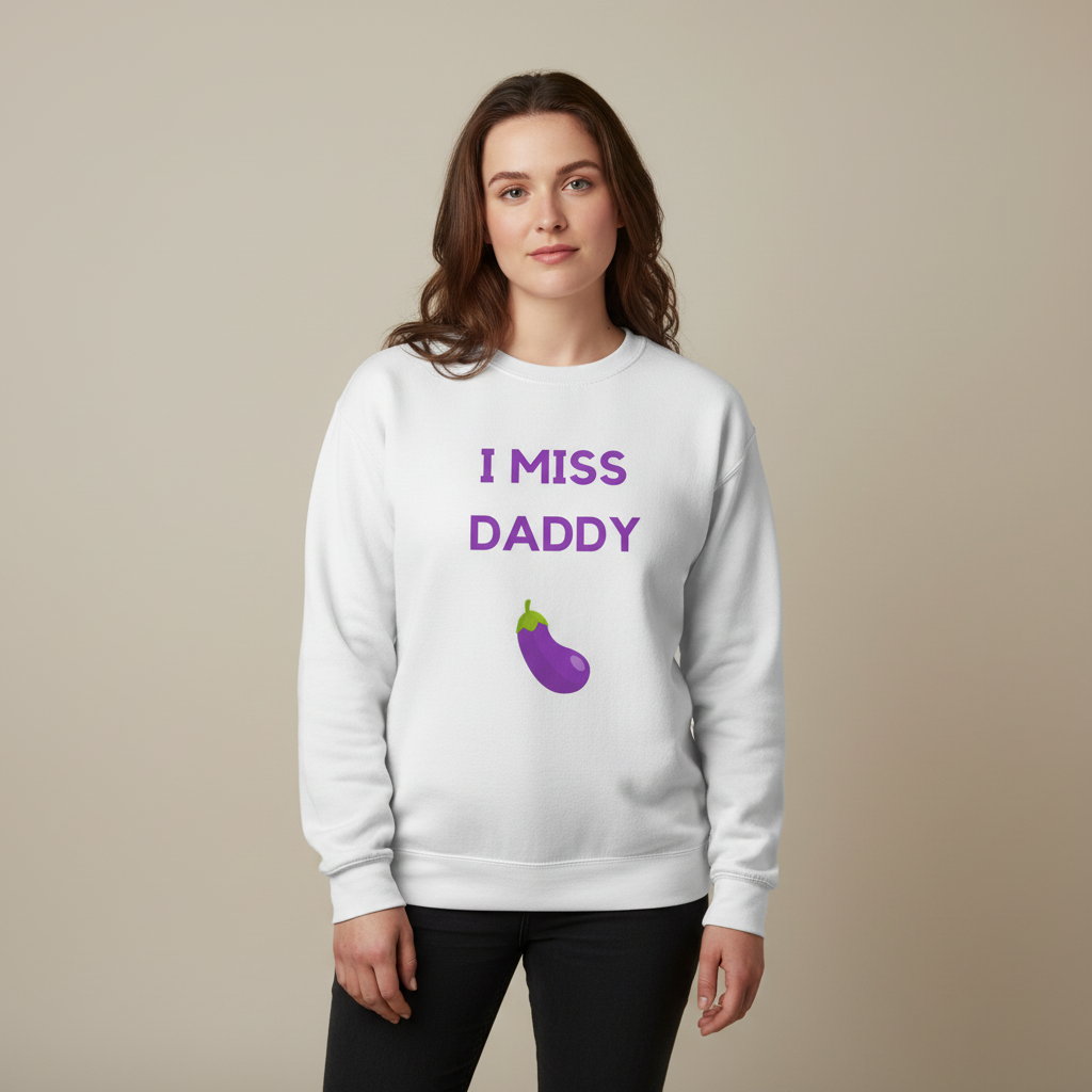 Young woman wearing the I Miss Daddy Unisex Sweatshirt with purple text and eggplant graphic, embodying LGBTQ pride and self-expression. Cozy, stylish, and perfect for celebrating queer identity with confidence.
