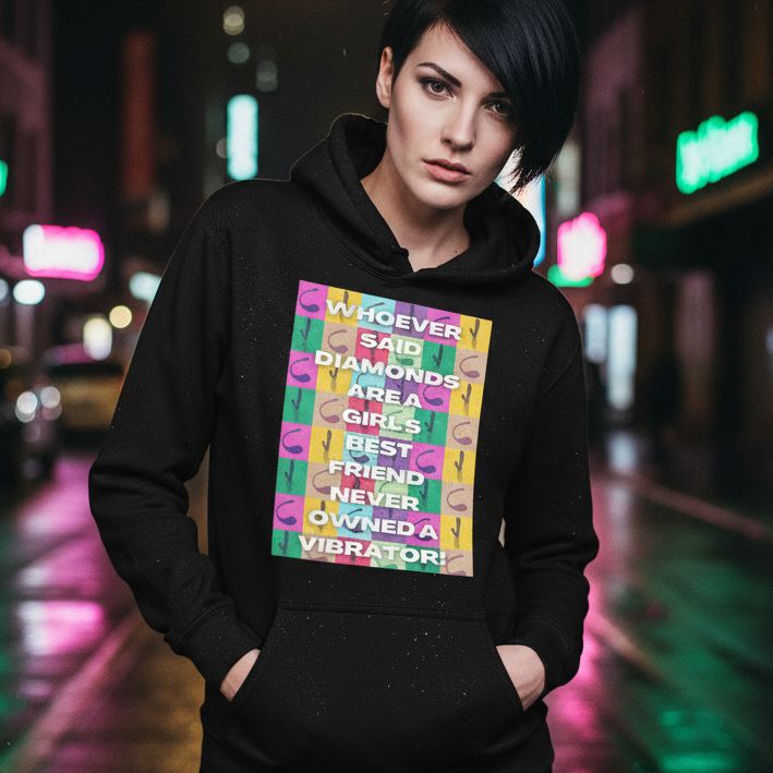 Young person in urban nightlife wearing the Never Owned a Vibrator Unisex Hoodie, featuring a bold, colorful checkerboard slogan. This cozy, soft hoodie celebrates queer pride, empowerment, and playful self-expression.