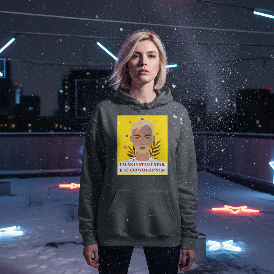 Model wearing a dark gray hoodie with a colorful portrait and “I'M AN INSTANT STAR” slogan