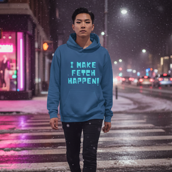 Front-facing person in a blue hoodie reading “I MAKE FETCH HAPPEN!” on a snowy city street