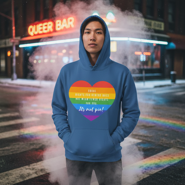 Model wearing a blue hoodie with a rainbow heart reading “It's not pie!”