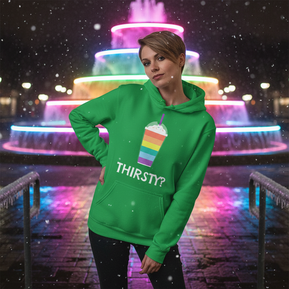 Green hoodie with rainbow popsicle graphic and “THIRSTY?” text, worn in front of neon lights