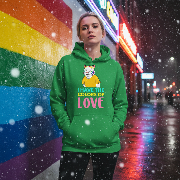 Person wearing a green hoodie with a colorful tiger and “I HAVE THE COLORS OF LOVE” text