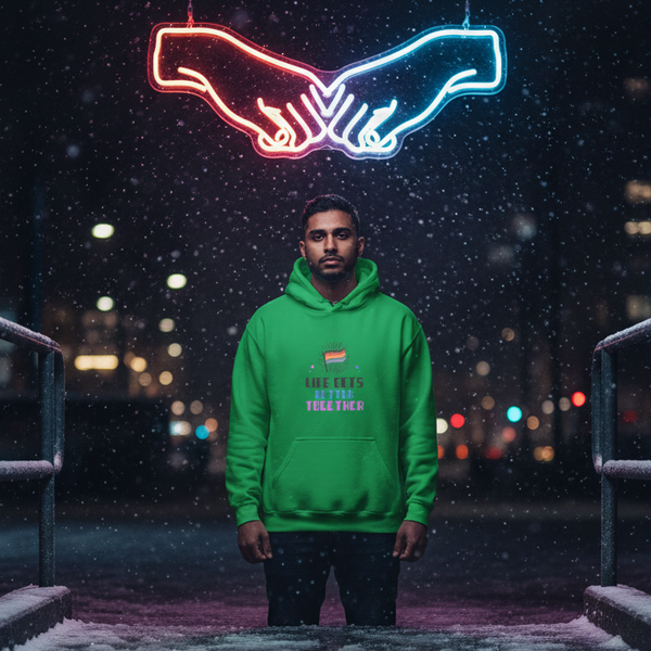 Person wearing a green “Life Gets Better Together” hoodie on a snowy city bridge