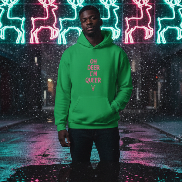 Model wearing a green hoodie reading “OH DEER I’M QUEER” in front of neon reindeer