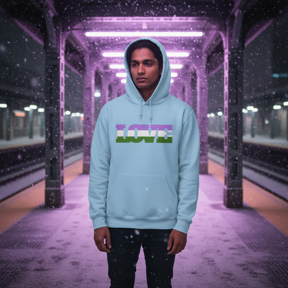 Front-facing model in a light blue hoodie with a multicolor “LOVE” graphic on a snowy train platform