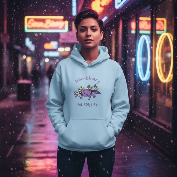 Person wearing a pale blue hoodie reading “Non-binary • Pal for Life” with a cartoon axolotl