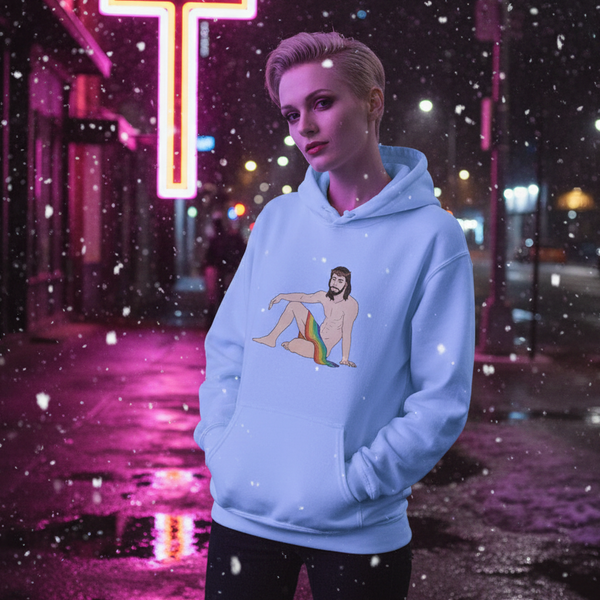 Person in a light blue hoodie with a seated rainbow-draped Jesus graphic in falling snow