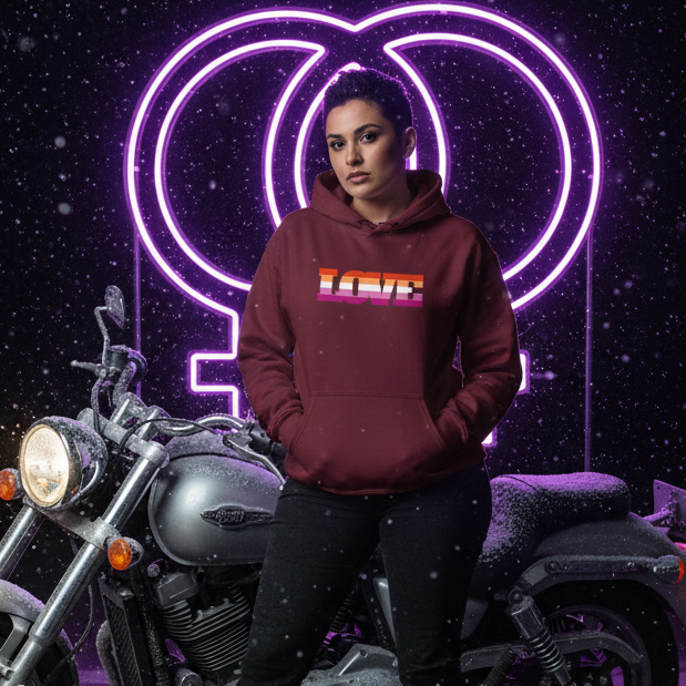 Model wearing a burgundy LOVE hoodie beside a motorcycle, with a glowing female symbol behind her