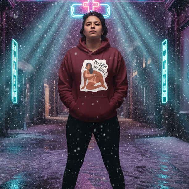 Front view of a person wearing a burgundy hoodie reading “MY BODY MY RULES” in a neon-lit alley