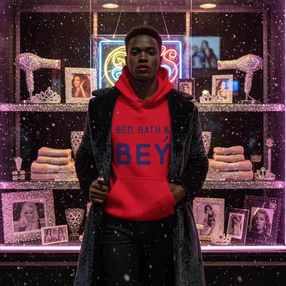 Model wearing a red “BED, BATH & BEY” hoodie beneath a dark coat