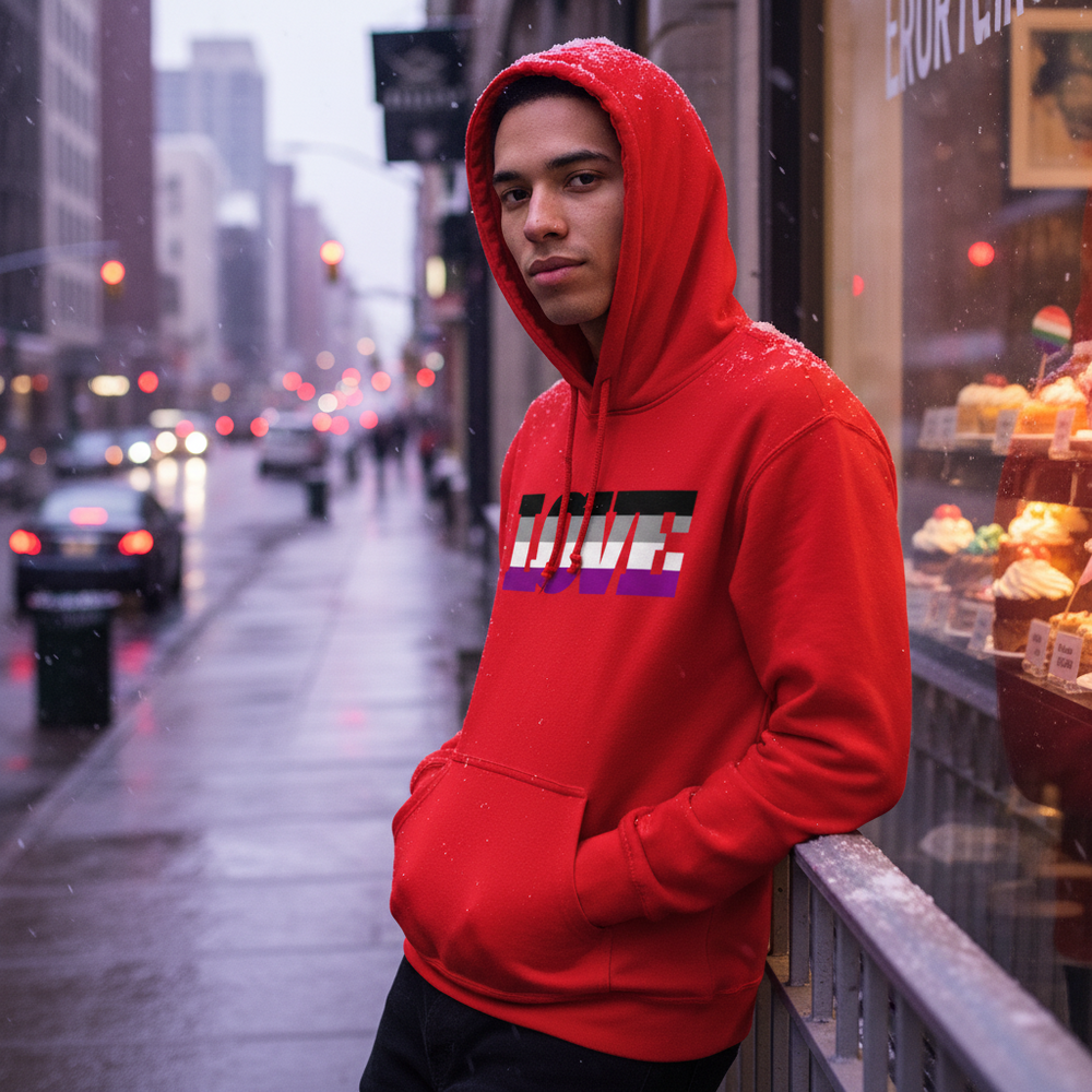 Person in a red hooded sweatshirt with multicolor LOVE lettering on a rainy city sidewalk