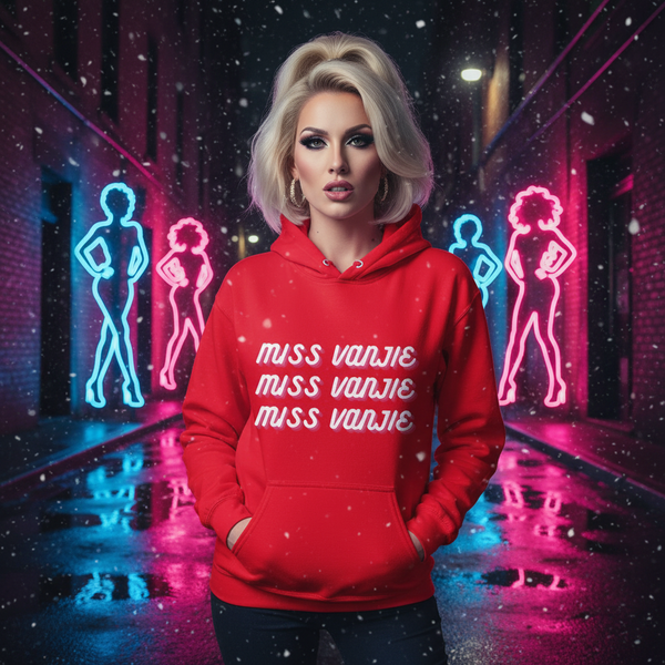 Model wearing a red hoodie reading “MISS VANJIE” three times in a neon-lit snowy alley