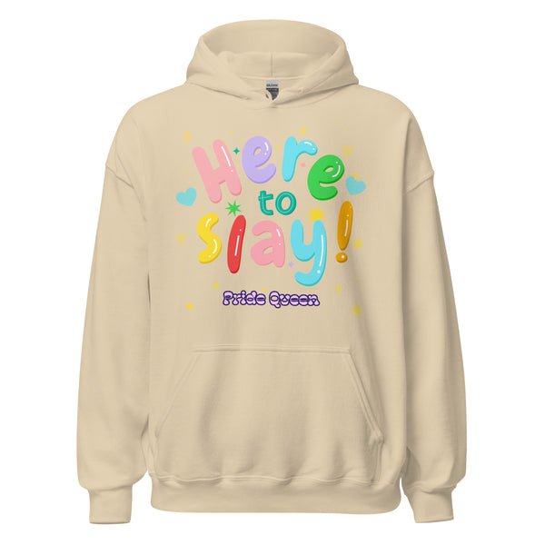 The Here To Slay! Pride Queen Unisex Hoodie showcases a vibrant, multicolored graphic with playful fonts and symbols, celebrating LGBTQIA+ pride and self-expression in a light-beige pullover design.