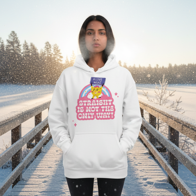 A young person wears the Straight Is Not The Only Way! Unisex Hoodie featuring a rainbow-framed cat graphic, embodying LGBTQ+ pride and empowerment against a serene, snowy backdrop.