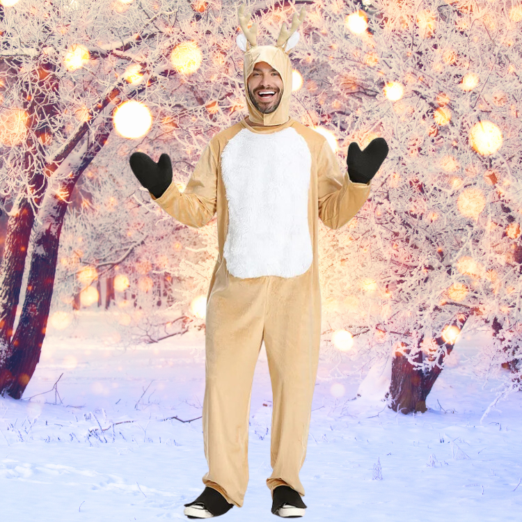 Smiling person in a tan reindeer onesie with antlers and black mittens in a snowy forest