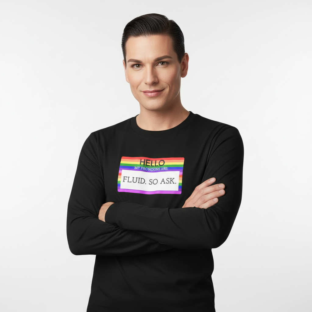 Unisex long sleeve tee with "Hello My Pronouns Are Fluid. So Ask" and a rainbow-striped nametag, worn by a smiling person.
