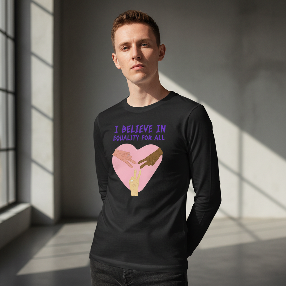 Black unisex long sleeve tee with pink heart, two diverse hands, and "I BELIEVE IN EQUALITY FOR ALL" in purple text.