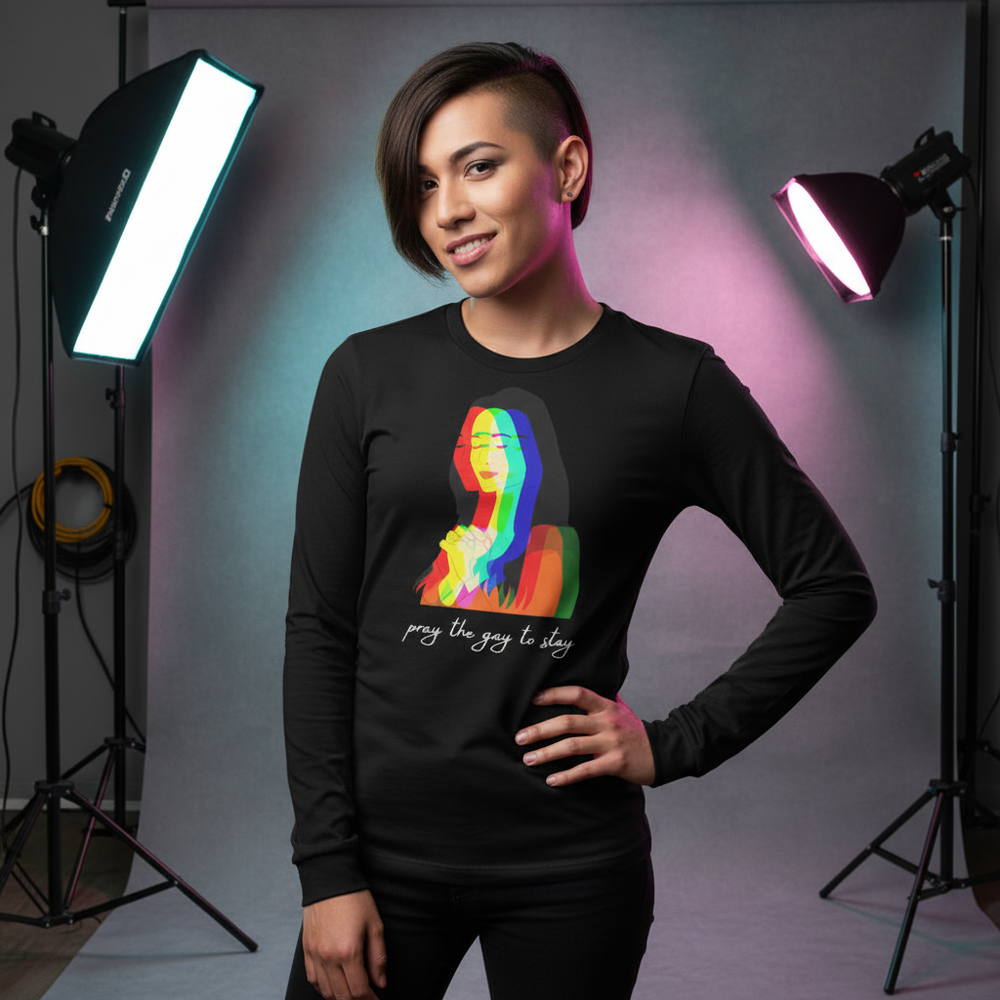 Model wearing a black long-sleeve shirt with a colorful praying figure and “pray the gay to stay” text