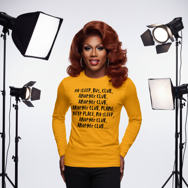 Front view of a person wearing a mustard long-sleeve shirt with black club-themed text