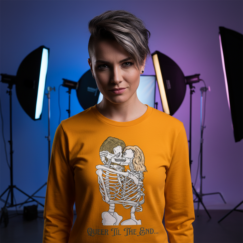Model wearing an orange long-sleeve shirt with embracing skeletons and “Queer ’Til The End…” text