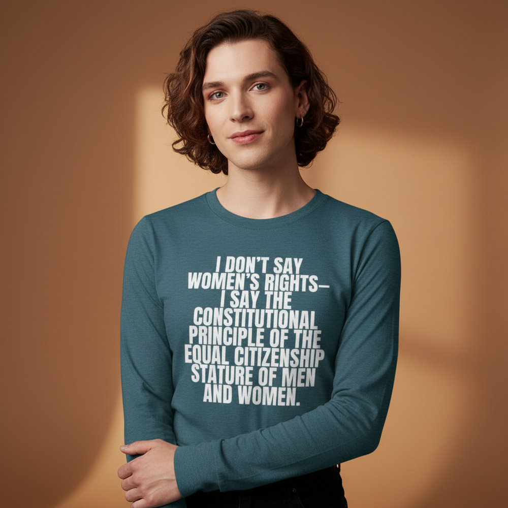 Teal unisex long sleeve tee reading "I Don't Say Women's Rights" in bold white text, worn by a person with wavy brown hair.